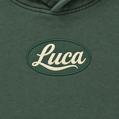 Close-up of the Luca chest design on the green Luca Original hoodie
