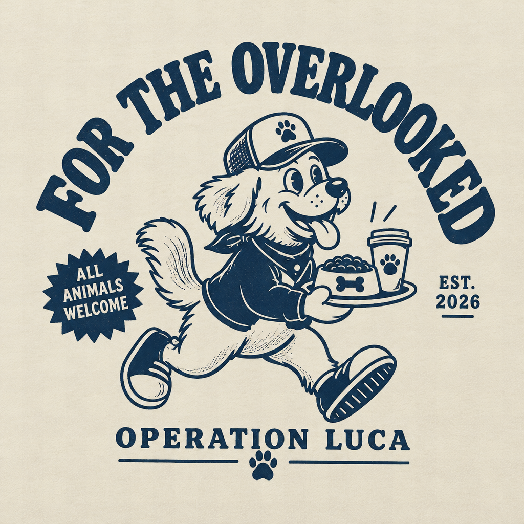Close-up of the navy Pups To-go dog graphic on the cream T-shirt
